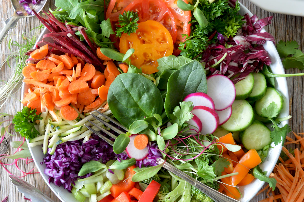 Bowl of salad with leafy greens and colourful vegetables